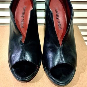 Luxury Rebel V cut black leather peep toe bootie.